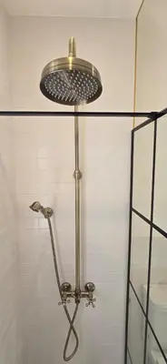 a shower with a shower head in a bathroom at Admiral Suite in Belgrade