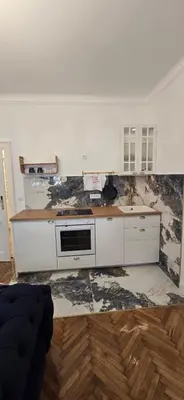 a kitchen with a stove and a counter top at Admiral Suite in Belgrade