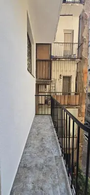 an empty hallway of a building with two balconies at Admiral Suite in Belgrade