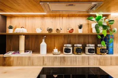 a kitchen with a shelf with jars and plants at Chill Flow 110m2 with Balcony Old Town Renovated in Belgrade
