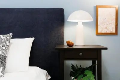 a bedroom with a bed and a lamp on a table at Chill Flow 110m2 with Balcony Old Town Renovated in Belgrade
