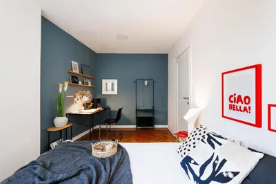 a bedroom with a blue accent wall at Chill Flow 110m2 with Balcony Old Town Renovated in Belgrade