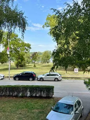 a group of cars parked in a parking lot at Apartman KEJ Smederevo in Smederevo