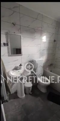 a bathroom with a sink and a toilet and a tub at Sandra Brend in Beograd