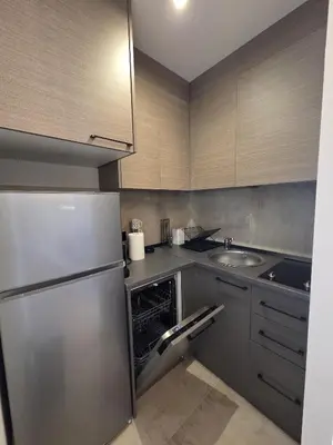 a kitchen with a stainless steel refrigerator and a sink at Dukk in Belgrade