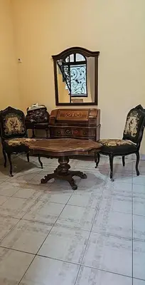 a room with a table and two chairs and a mirror at Swiss Luxury Apartment in Beograd