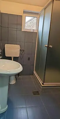 a bathroom with a shower and a toilet and a sink at Swiss Luxury Apartment in Beograd