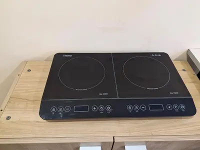 a black radio sitting on top of a wooden table at Apartman New in Belgrade