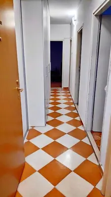 an empty hallway with an orange and white checkered floor at Home Sweet Home No1 in Belgrade
