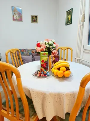 a table with fruit and snacks on top of it at Home Sweet Home No1 in Belgrade