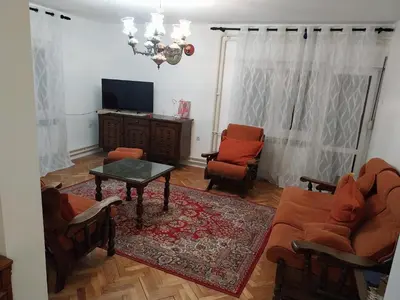 a living room with a couch and chairs and a tv at Dve Breze