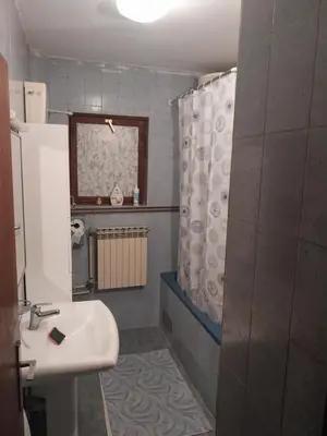 a bathroom with a sink and a shower at Dve Breze