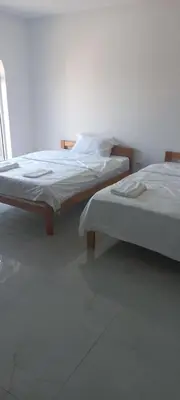 two beds sitting next to each other in a room at All SEASON in Beograd