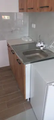a kitchen with a sink and a counter top at All SEASON in Beograd