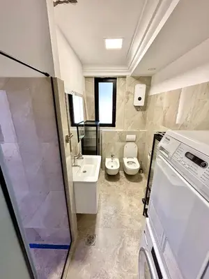 a bathroom with two toilets and a sink at ONYX Grand SPA Suite Zemun in Belgrade