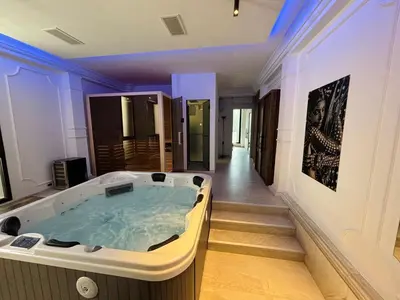 a jacuzzi tub in the middle of a room at ONYX Grand SPA Suite Zemun in Belgrade