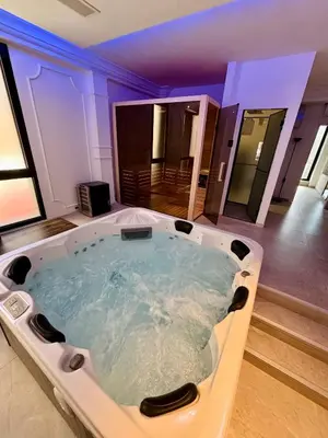 a jacuzzi tub in the middle of a room at ONYX Grand SPA Suite Zemun in Belgrade