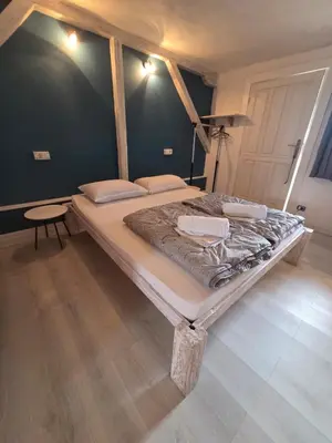 a large bed in a room with at Appartamento con ingresso privato e vista giardino in Belgrade