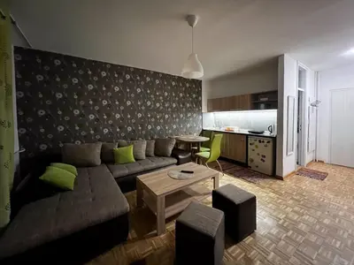 a living room with a couch and a table at Blok 63 in Beograd
