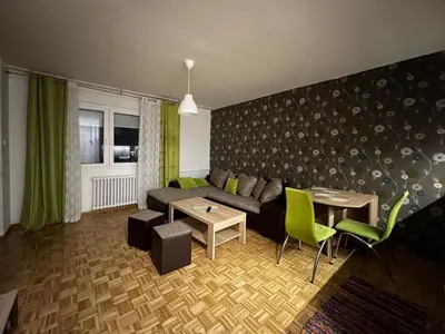 a living room with a couch and a table at Blok 63 in Beograd