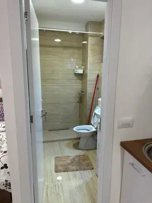 a bathroom with a shower with a toilet and a sink at Cozy studio in Belgrade in Belgrade