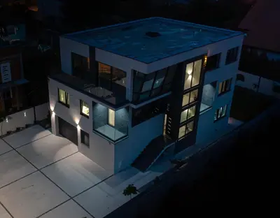 a rendering of a house at night at Villa Cocosinella Belgrade in Surčin
