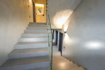 a staircase leading to the second floor of a house at Villa Cocosinella Belgrade in Surčin