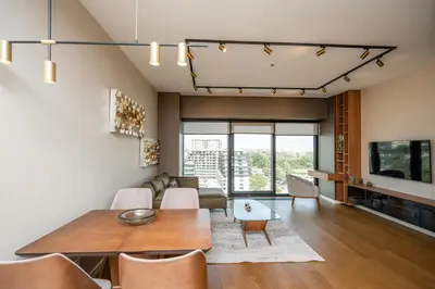 a living room with a table and a couch at Star West Luxury in Belgrade