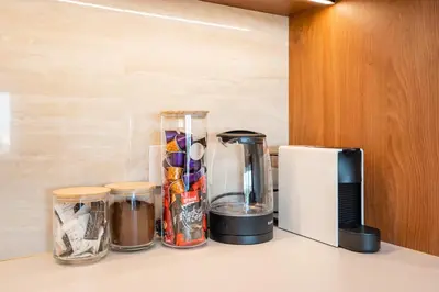 a kitchen counter with a blender and a coffee maker at Star West Luxury in Belgrade