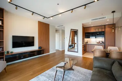 a living room with a couch and a tv at Star West Luxury in Belgrade