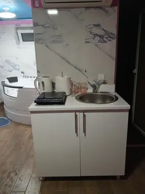 a kitchen with a sink and a counter top at Apartman IN Pančevo in Pančevo