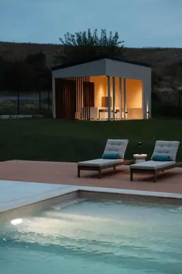 a house with two lounge chairs and a swimming pool at Like a therapy VILLA in Krčedin