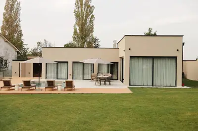 a house with a lawn in front of it at Like a therapy VILLA in Krčedin