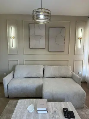 a living room with a couch and a table at The Wolf Residence in Inđija