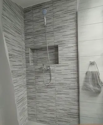 a bathroom with a shower with a shower head at Belgrade City Home in Belgrade