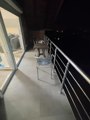 a balcony with a table and a chair on it at Belgrade City Home in Belgrade