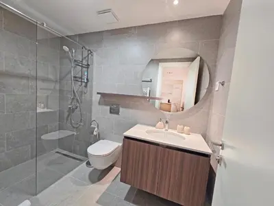 a bathroom with a sink and a toilet and a shower at Eterna Premium Apartment 1 Bedroom in Sajmište