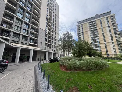 a street with two tall buildings in a city at NEW! Modern Studio Belgrade Waterfront in Belgrade