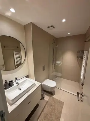 a bathroom with a sink and a toilet and a mirror at NEW! Modern Studio Belgrade Waterfront in Belgrade