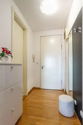 a room with a white door and a white stool at DC Belgrade, modern, super comfy, garage parking in Belgrade