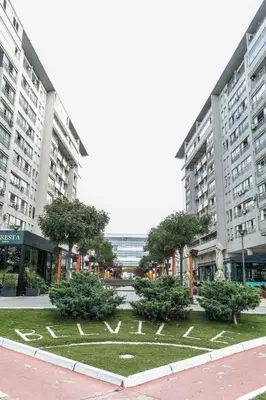 a park in front of two large buildings at DC Belgrade, modern, super comfy, garage parking in Belgrade