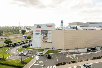 a parking lot in front of a large building at DC Belgrade, modern, super comfy, garage parking in Belgrade