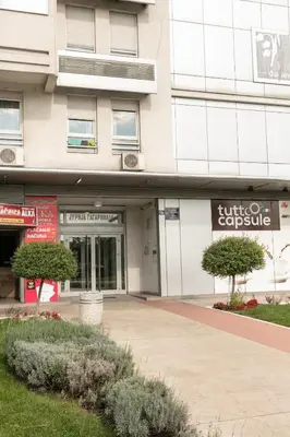 a building with a sign that reads hotel capsule at DC Belgrade, modern, super comfy, garage parking in Belgrade