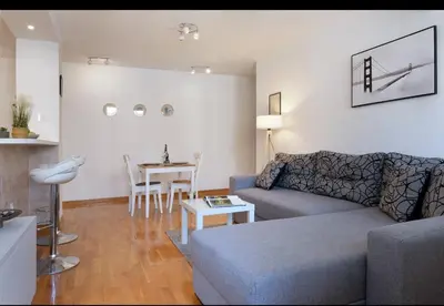 a living room with a couch and a table at Belgrade Central Residence in Belgrade