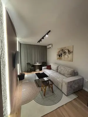 a living room with a couch and a table at Belgrade Nest in Belgrade