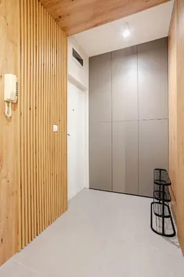 a room with a closet and a chair in it at Belgrade Nest in Belgrade