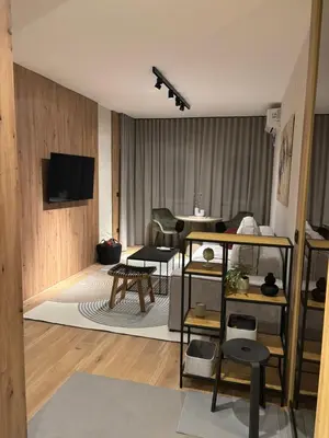 a living room with a couch and a table at Belgrade Nest in Belgrade