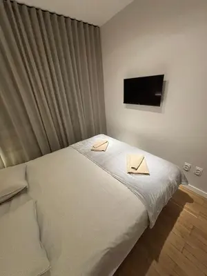 a bedroom with a bed with two towels on it at Belgrade Nest in Belgrade