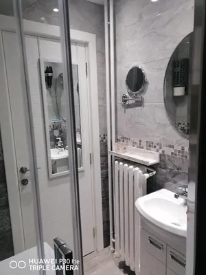 a bathroom with a sink and a mirror at City pioneer Apartmens in Belgrade
