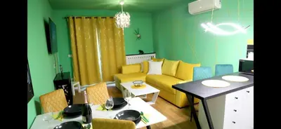 a living room with a couch and a table at 1 Bedroom Apartment Belgrade in Belgrade